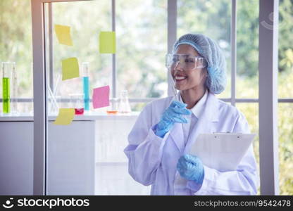 Woman scientist hand write note information in medical lab look at science microscope medical test, research biology chemistry. Asian Females technician laboratory analyzing blood test pharmaceutical