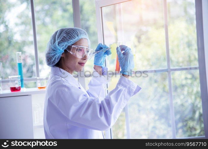 Woman scientist hand write note information in medical lab look at science microscope medical test, research biology chemistry. Asian Females technician laboratory analyzing blood test pharmaceutical