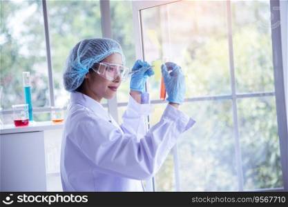 Woman scientist hand write note information in medical lab look at science microscope medical test, research biology chemistry. Asian Females technician laboratory analyzing blood test pharmaceutical