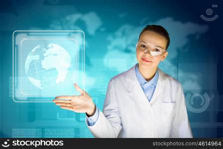 Woman scientist. Image of young woman scientist in goggles against media screen