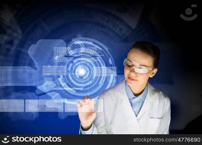 Woman scientist. Image of young woman scientist in goggles against media screen