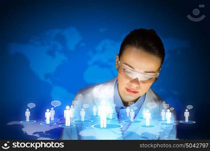 Woman scientist. Image of young woman scientist in goggles against media screen. Net communication