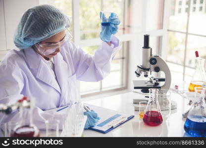 Woman scientist in lab look at science microscope medical test and research biology chemistry. Females technician laboratory analyzing scientific pharmacy genetic research. Chemistry Medical test lab