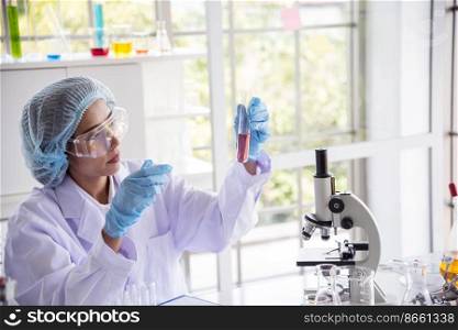 Woman scientist in lab look at science microscope medical test and research biology chemistry. Females technician laboratory analyzing scientific pharmacy genetic research. Chemistry Medical test lab