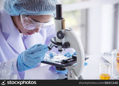 Woman scientist in lab look at science microscope medical test and research biology chemistry. Females technician laboratory analyzing scientific pharmacy genetic research. Chemistry Medical test lab