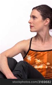 Woman Seated in Yoga Pose Turned to Left