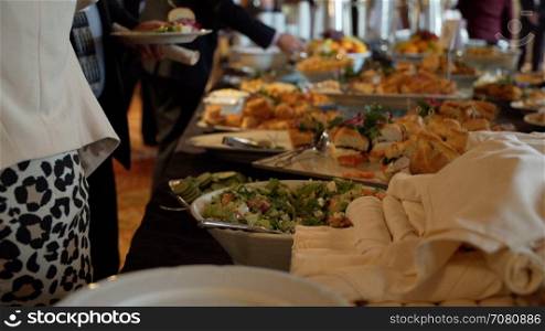 Woman selecting buffet food at a conference