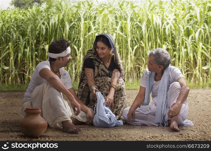 Woman serving lunch to farmers in field