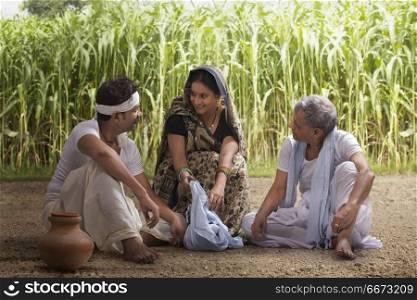 Woman serving lunch to farmers in field