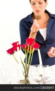 Woman setting table romantic dinner roses Valentine&acute;s day