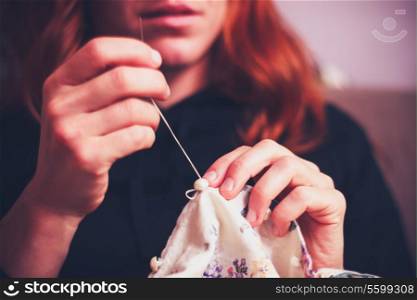 Woman sewing at home