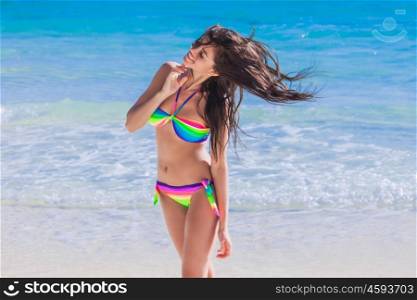 Woman shaking hair on beach. Woman shaking hair in bikini on beach