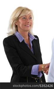 Woman shaking hands with a client
