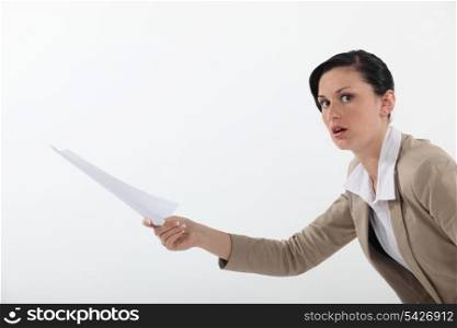 Woman shocked at a piece of paper
