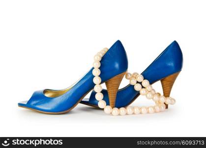 Woman shoes and necklace isolated on the white background