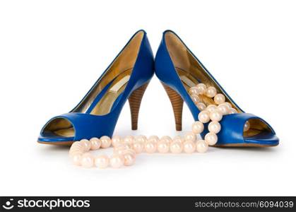 Woman shoes and necklace isolated on the white background