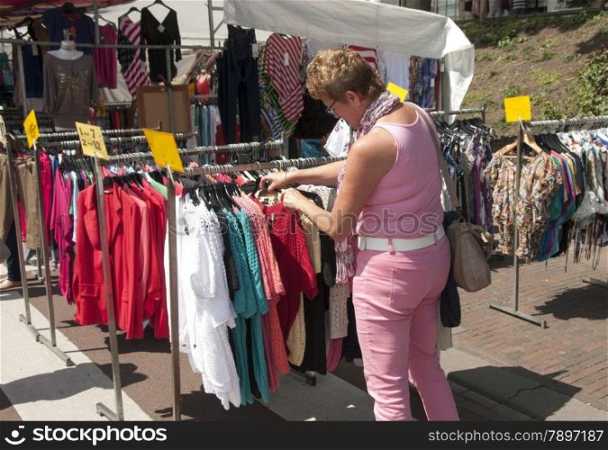 woman shopping clothes on the market