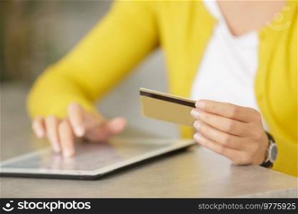 woman shopping using tablet pc and credit card