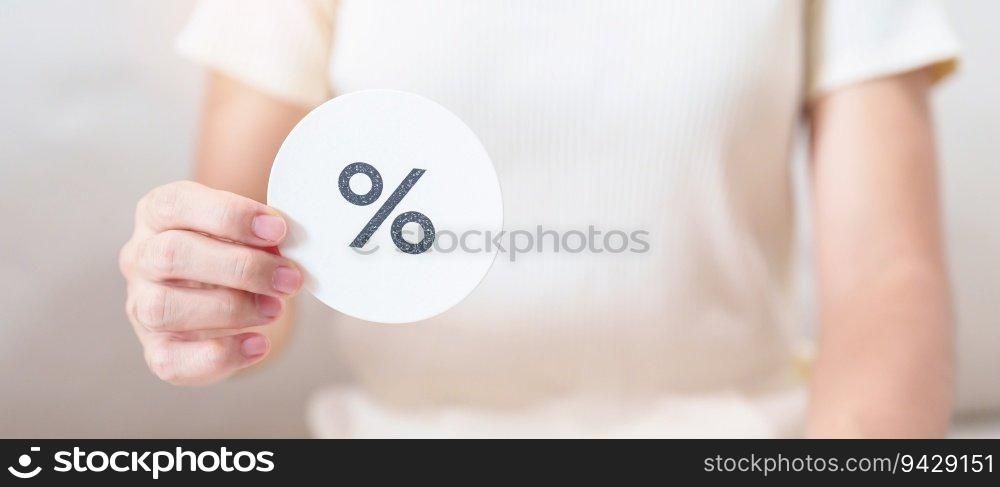 Woman show percentage symbol paper. Interest rate, financial, ranking, discount and promotion and mortgage rates concept
