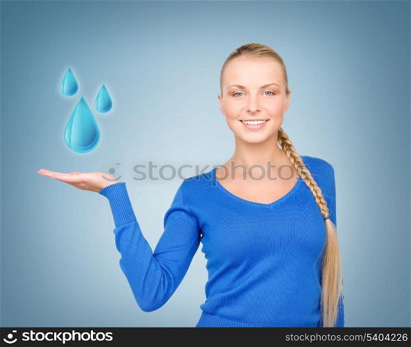 woman showing blue water drops on her hand