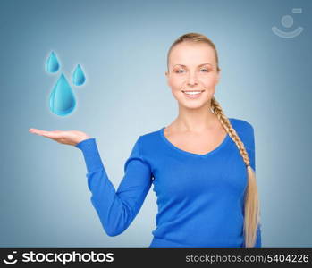 woman showing blue water drops on her hand