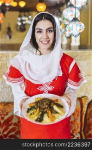 woman showing dish arab food
