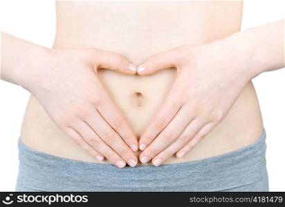 Woman showing heart shape with her hands on stomach