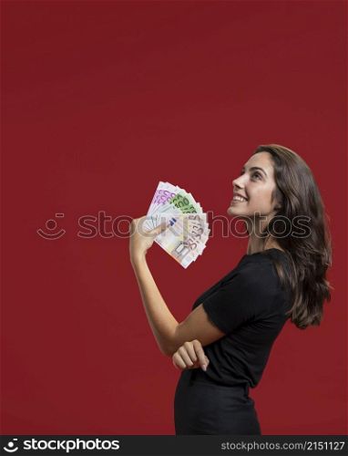woman showing her shopping money with copy space