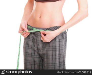 Woman showing how much weight she lost. Healthy lifestyles concept isolated