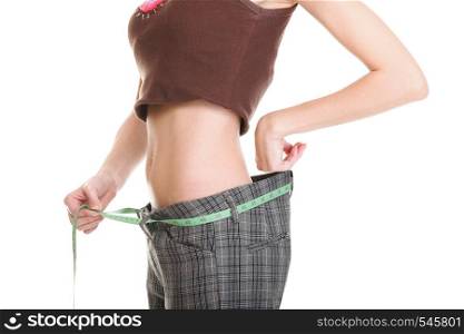 Woman showing how much weight she lost. Healthy lifestyles concept isolated