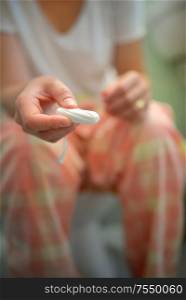 Woman Showing Menstrual Tampons In Her Hands