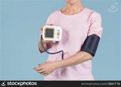 woman showing results blood pressure electric tonometer screen. Resolution and high quality beautiful photo. woman showing results blood pressure electric tonometer screen. High quality and resolution beautiful photo concept