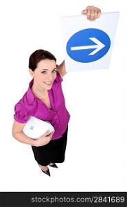 Woman showing road sign of obligation to turn right