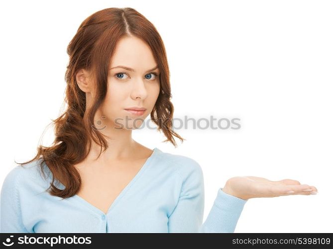 woman showing something on the palm of her hand