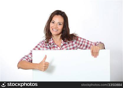 Woman showing white board on white background