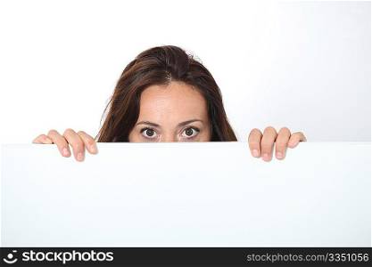 Woman showing white board on white background