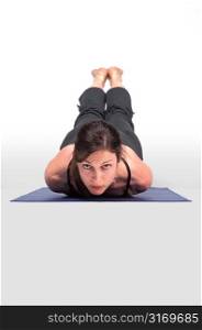 Woman Shown Head On in Yoga Pose With Legs Uplifted