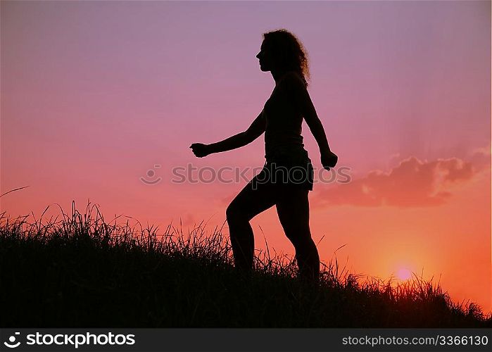 woman silhouette at sunset