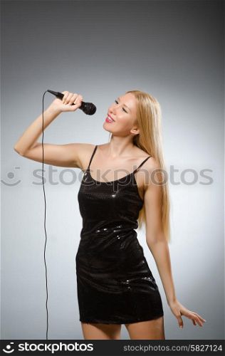Woman singing in karaoke club