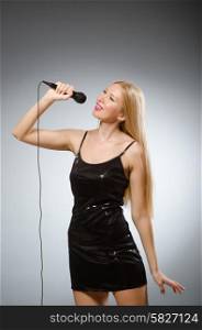 Woman singing in karaoke club