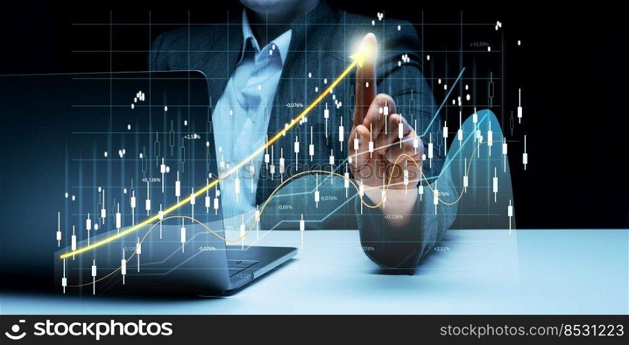 Woman sits at a laptop in front of a holographic chart with growing indicators. Business development, high financial performance, success.