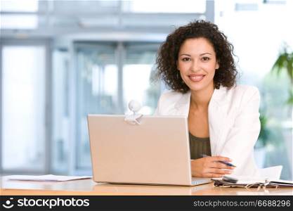 woman sitting at laptop in office