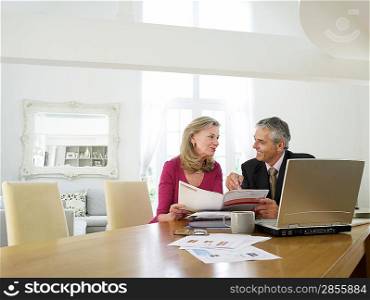 Woman sitting at table with financial advisor