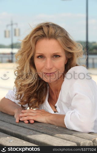 Woman sitting backward on bench