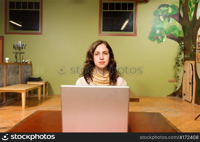 Woman Sitting Behind Laptop