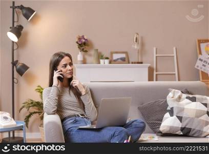 woman sitting couch working