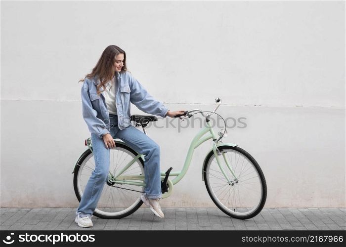 woman sitting her bike outdoors