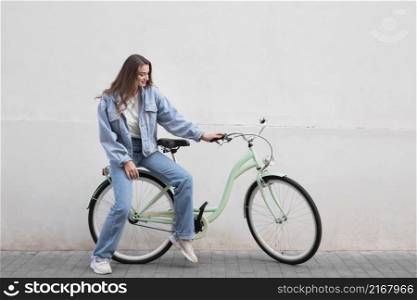 woman sitting her bike outdoors