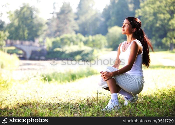 Woman sitting in a meadow