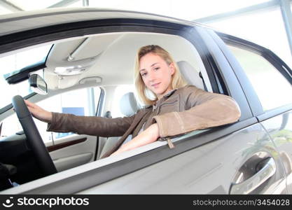 Woman sitting in brand new car